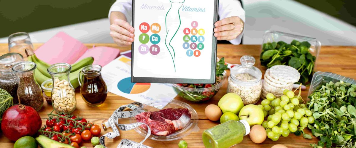 dietitian-with-vitamin-sheme-at-the-table-full-of-2025-03-15-04-51-06-utc-min